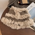 Brown knit bucket hat with beige plush faux fur trim on a dark wooden background - Rabbit Fur Bucket-Khaki