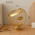 Golden iron wire coffee pod storage basket with circular hollow design and stable base - Elevated Style: Luxury Gold Basket