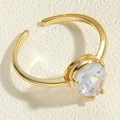 Close-up of golden adjustable ring featuring a faceted pear-cut clear crystal stone - Adjustable Open / Gold Water Drop