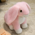 Plush rabbit doll in pink and white faux fur with long ears and realistic eyes - Pink Rabbit