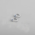 Close-up of silver snake earrings featuring sparkling blue gemstone eyes for a luxury look - Platinum (Blue Eyes)