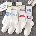 White crew socks featuring colorful graffiti letter patterns in a street fashion style - Unisex (35-44) / 9 Series Mixed Graffiti