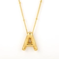 Golden balloon style letter A pendant necklace with bead chain on white background - Gold - A