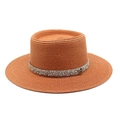 Detailed view of the woven brown straw hat featuring rhinestone band and 'M' metal plaque - M (56-58cm) / Caramel color