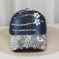Detailed close-up of denim baseball cap with silver rhinestones and white floral patches - No.6/Dark Blue Denim/Full Rhinestone Flowers