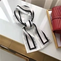 Elegant long black and white silk hair ribbon with cursive lettering pattern detail - Black & White Stripes