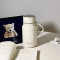 Cream white stainless steel vacuum insulated bottle with carrying strap for outdoor use - 650ml / Off White