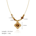Velvet flower necklace with tiger eye beads and sun pendant in gold plated titanium - Gold