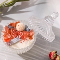 Romantic scented soy candle in a clear glass jar with dried flowers and Longfine label - Pomelo Lily