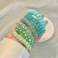 Pack of assorted spiral hair ties featuring solid blue, floral and polka dot patterns - 5# Green/Cyan Patterns (6pcs Bag)