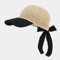 Detail of beige crochet straw cap with long black ribbon bow and mesh texture - One Size / Beige