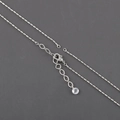 Detail view of silver-plated cross chain featuring a lobster clasp and extender chain - Silver Cross Chain