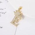 Detailed close-up of a gold-plated crown letter E pendant with sparkling zircon inlay - Letter E