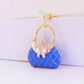Portachiavi a forma di borsa blu con strass e fiocco bianco in metallo smaltato - Blu
