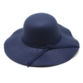 Close-up of navy blue thick felt fedora hat with elegant wavy brim and decorative band - Navy Blue