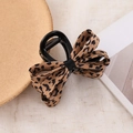 Elegant knit bow hair claw clip featuring a stylish brown and black leopard print design - Coffee Leopard