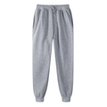 Detail view of gray thermal sweatpants featuring adjustable drawstring waist and ribbed cuffs - Light Gray