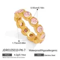 Gold stainless steel ring featuring circular pink cubic zirconia stones with dimensions - Round Eternity Band - Pink