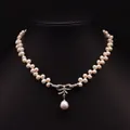 Double-layer natural pearl necklace with a diamond bow pendant and water-drop pearl charm - Bowknot Pearl Necklace