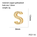 Macro detail of gold-plated copper letter S pendant with sparkling white zircon stones - S