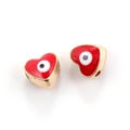 Macro detail of red heart-shaped evil eye enamel charms with gold metallic finish - 10pcs Red Evil Eye Heart Beads