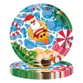 Stacked disposable paper plates featuring Santa Claus on a beach summer theme design - 9-inch Summer Christmas Printed Paper Plates