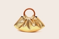 Detail of gold pleated cloud bag with crocodile texture and brown round handle - Gold