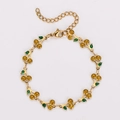 Detail of bohemian cherry bracelet with yellow faceted stones and green enamel leaves - Yellow