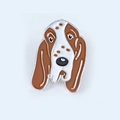 Macro shot of cartoon enamel basset hound pin showing detailed floppy ears and dog features - 9-Basset Hound/Beagle