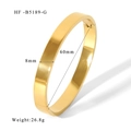 Detail view of 8mm gold mirror-polished stainless steel bangle with side hinge clasp - Width 8mm / Gold