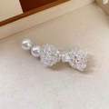 Elegant vintage-style hair clip featuring a clear beaded bow and white pearls. - White