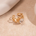 Detailed view of adjustable gold chain ring featuring a brilliant round zircon center stone - Gold Oval Wide