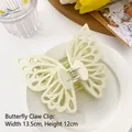 Creamy beige hollow double-layered butterfly hair claw clip sized 13.5cm by 12cm - White