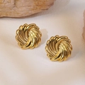 Golden vintage spiral earrings with polished radial texture in a high-end luxury style - Gold