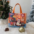 Christmas penguin canvas tote bag with orange handles and festive cartoon illustration - Christmas Penguin