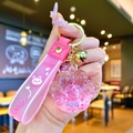 Pink cat paw keychain with liquid glitter stars and silicone wrist strap - Pink Luminous Bubble Bead Cat Paw