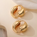 Orecchini a cerchio a goccia dorati minimalisti su un elegante supporto beige - Oro