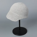 Close-up of light gray knitted aviator hat showing thick texture and peak detail - M / Gray
