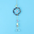 Detail of moon and star suncatcher with blue stones and clear crystal prisms - Blue Sodalite