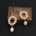 Baroque drop earrings with gold woven ring and large teardrop pearl on dark background - Hollow Loop Pearl