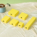 Bright yellow drawer jewelry gift boxes in various sizes on silk background - Yellow