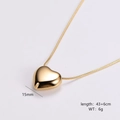 Macro shot of 15mm gold heart pendant with detailed 43cm snake chain measurements - Small / Gold