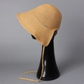 Detailed texture of lightweight straw sun hat with decorative metal logo and chin strap - M(56-58cm) / Earthy Yellow