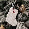 White knitted Christmas stocking with red embroidered letter L on a snowy tree - Embroidered Knitted Small Sock White L