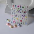Close-up of 5D embossed nail art stickers featuring delicate 3D floral designs - Garden Story Floral (TS-055)