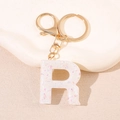 Porte-clés lettre R en résine avec paillettes colorées et anneau en métal doré - Lettre R