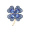 Elegant gold four-leaf clover brooch featuring pear-shaped blue crystals and pave rhinestones - Blue