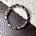 Close-up of wood block bracelet showing natural textures of green and purple sandalwood - Yaochen 7X13mm Single Loop