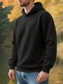 Gros plan sur la maille torsadée noire d'un sweat à capuche d'hiver pour homme - S / Noir