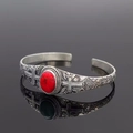 Vintage bohemian open bangle featuring red turquoise stone and carved cross details - Cross Ruby Color